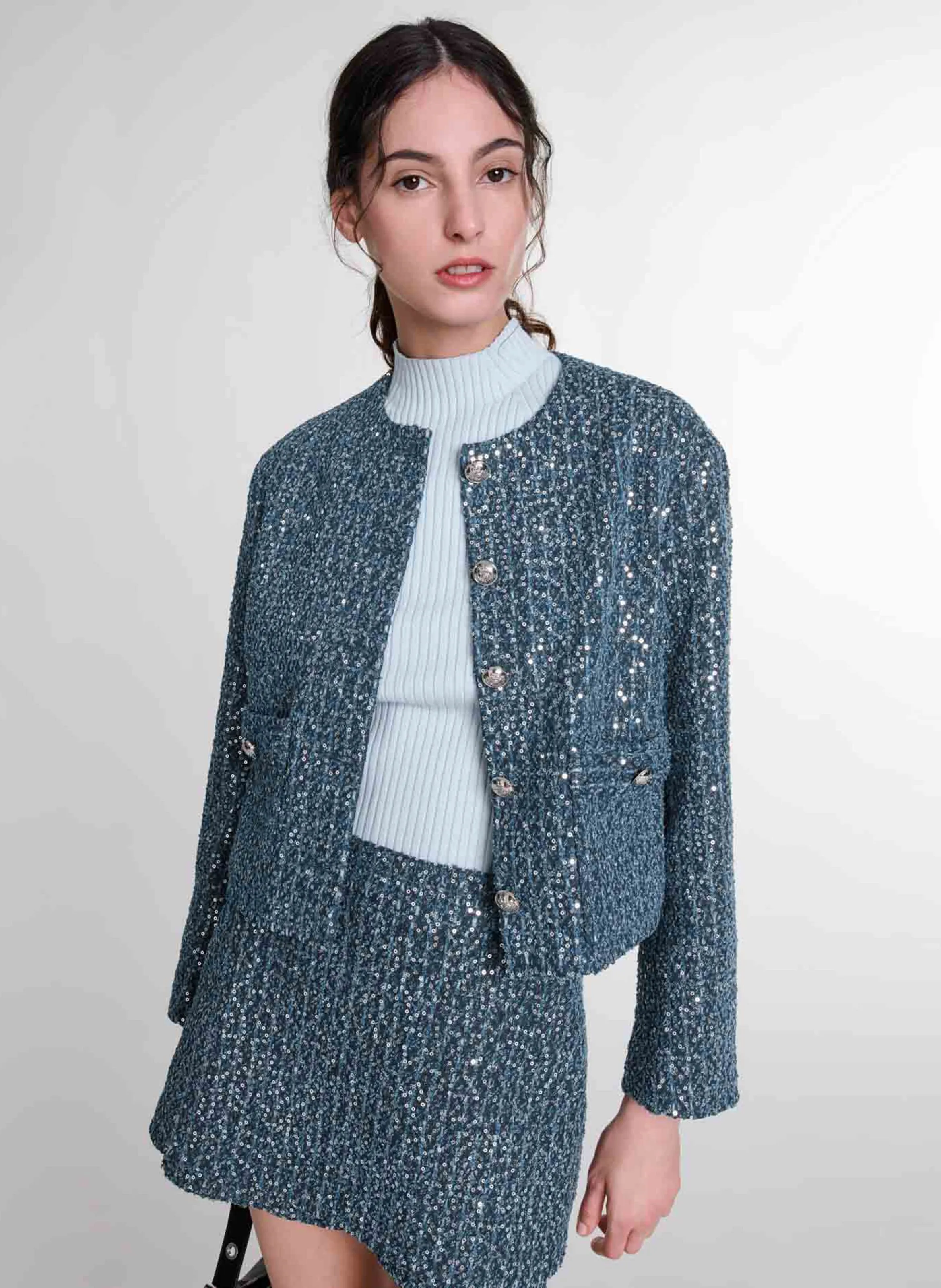 Chaqueta corta de tweed con lentejuelas. en azul