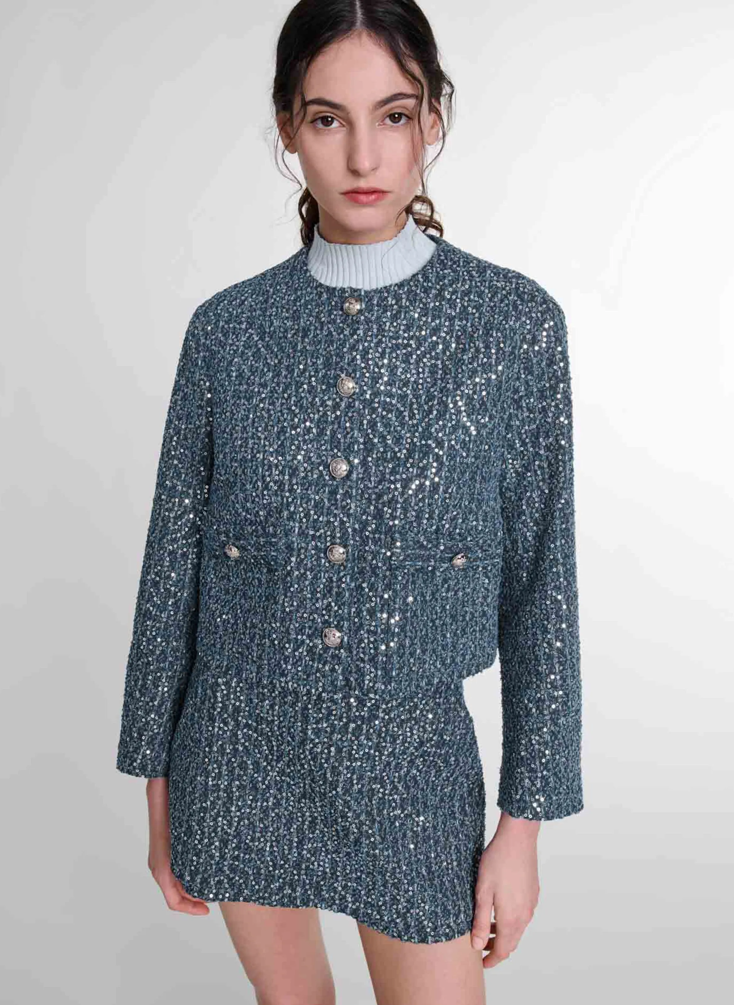Chaqueta corta de tweed con lentejuelas. en azul