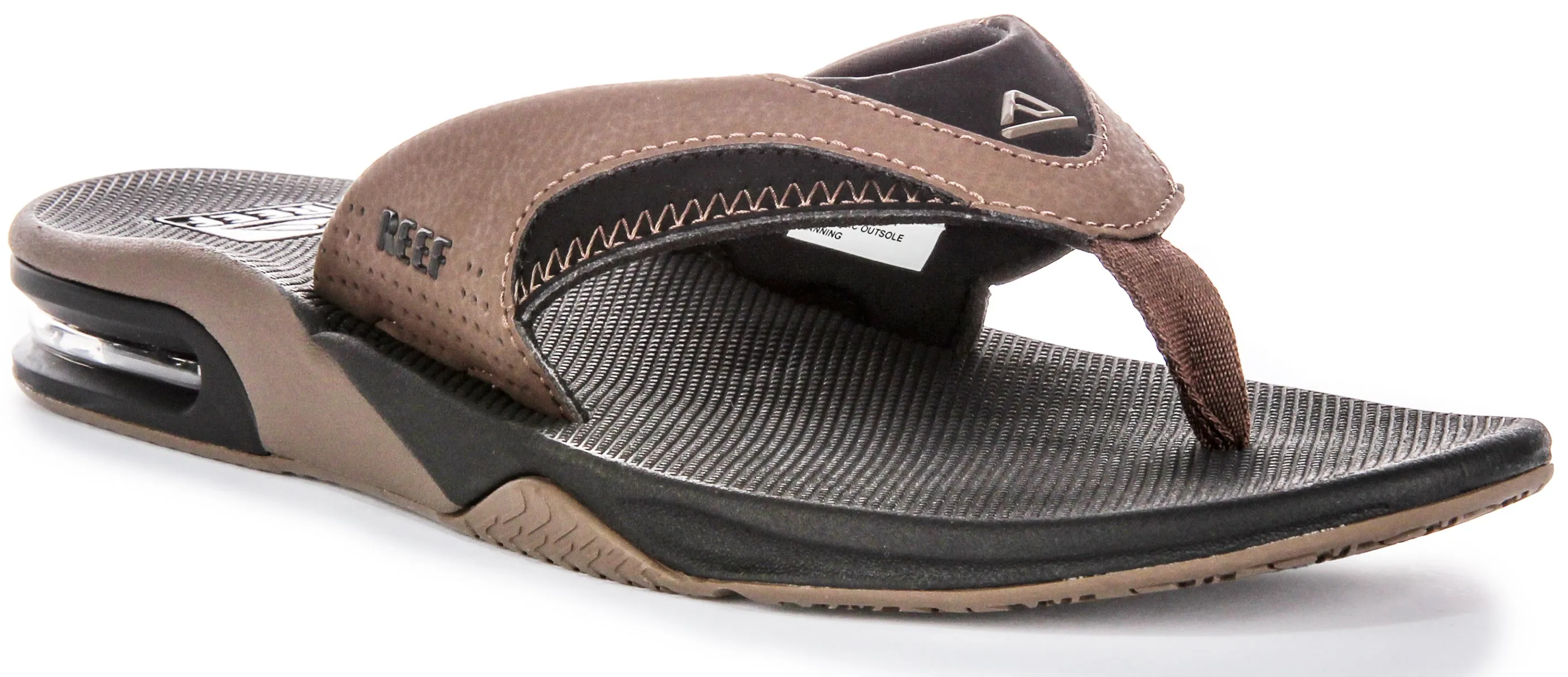 Reef M Fanning Bottle Opener Sandalias de cuero nobuck para hombre en color marrón negro